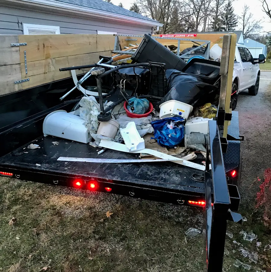 Roll-off dumpster delivered to a residential driveway in University Heights